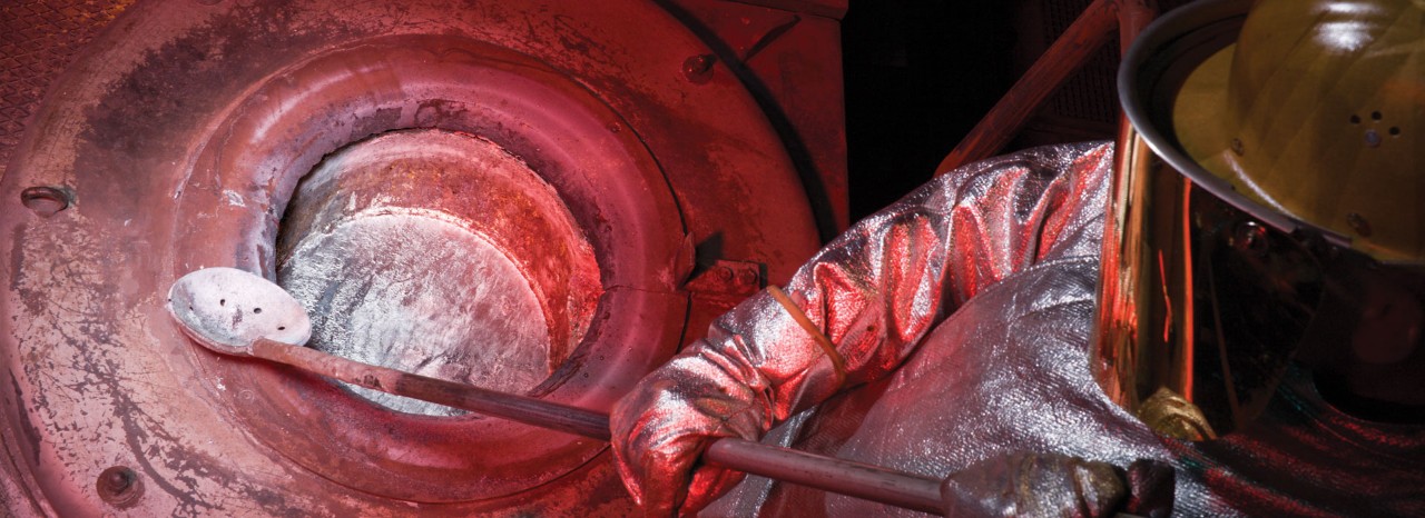Guy in aluminium foundry with crucible