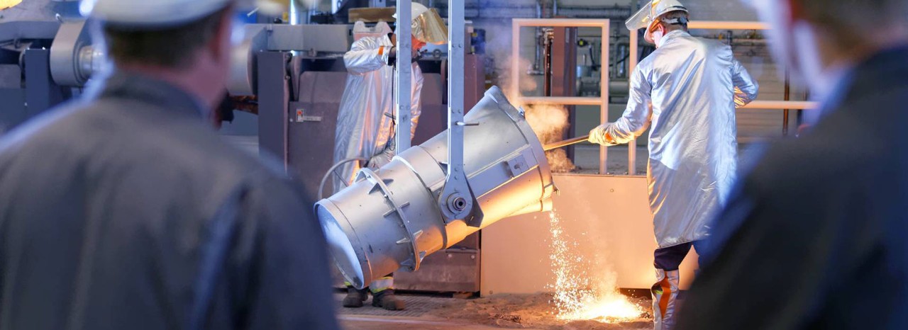 Picture of some foundrymen casting in an iron foundry